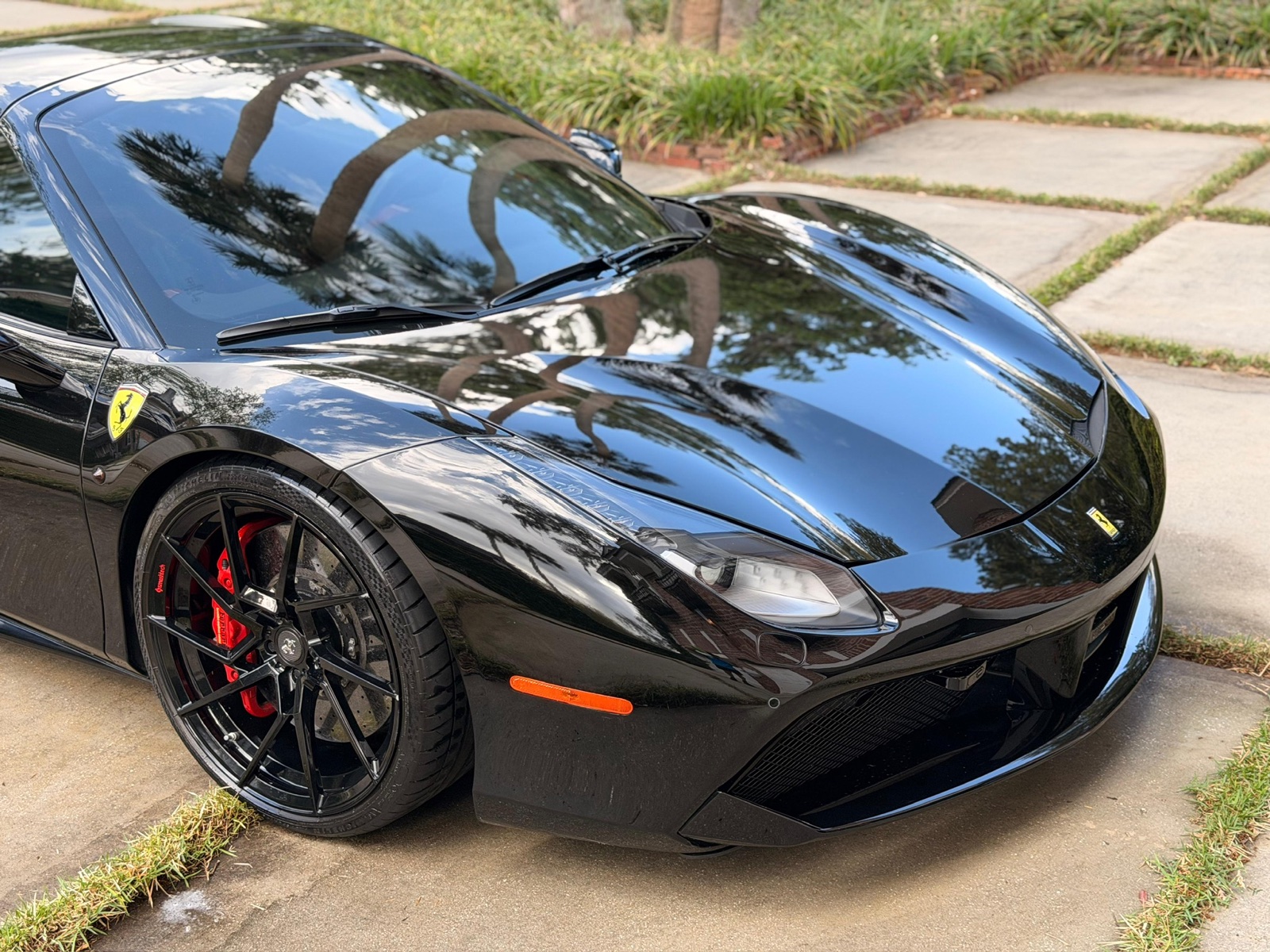 Black Ferrari 488 detailed to a mirror finish