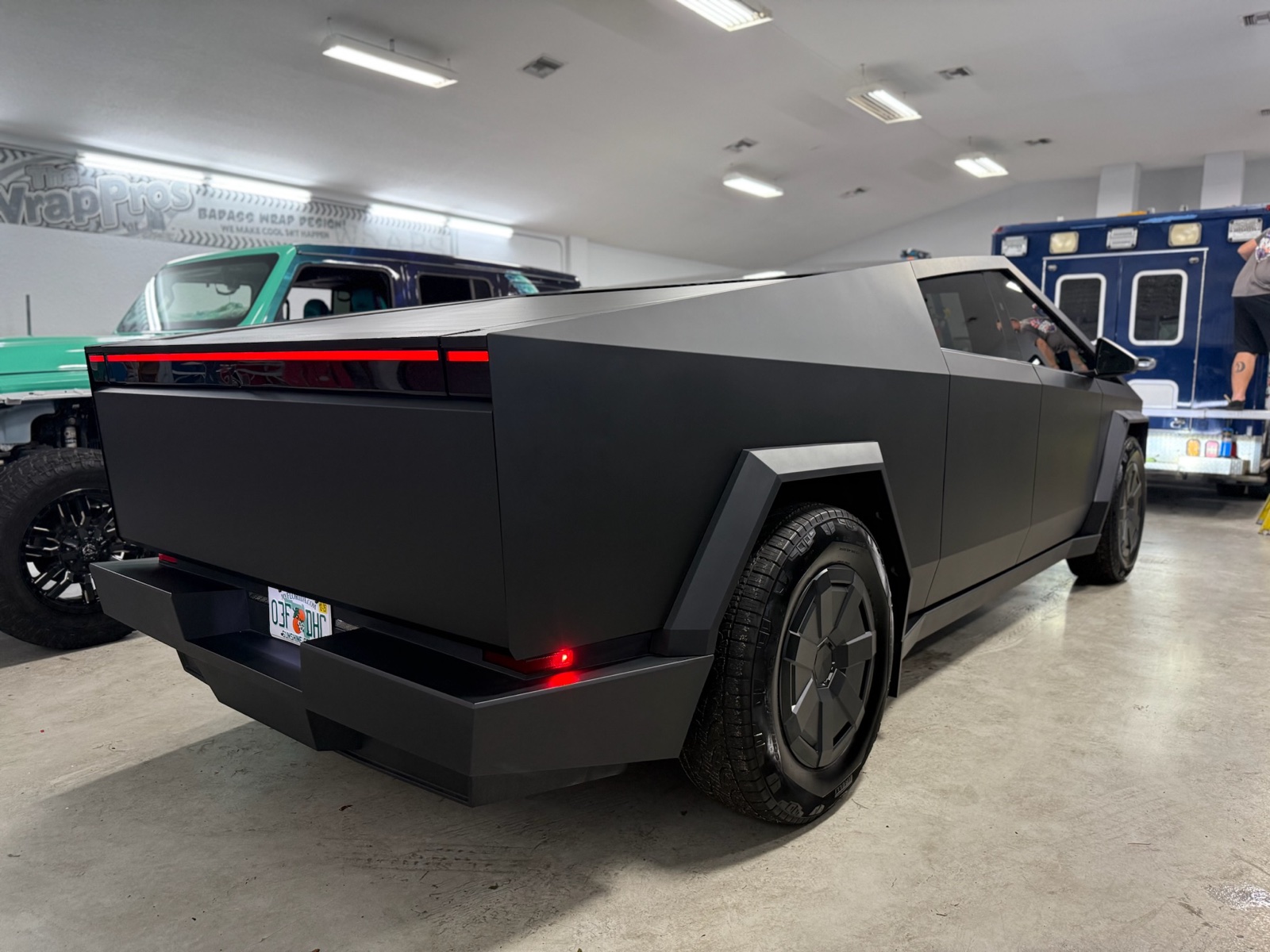 Matte black Tesla Cybertruck in the studio